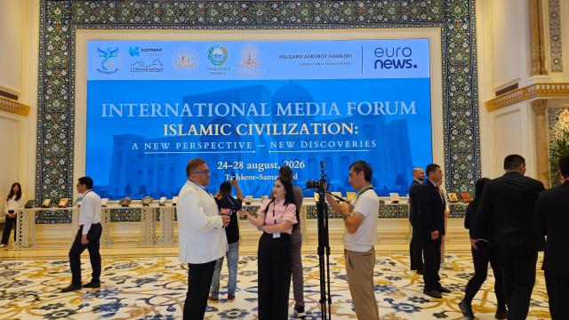 A television crew conducts an interview outside the Grand Conference Hall at the Center for Islamic Civilization in Tashkent Uzbekistan Aug 25 2026 About 300 media representatives and experts from 50 countries attended the International Media Forum AJP Lee Jung-woo 