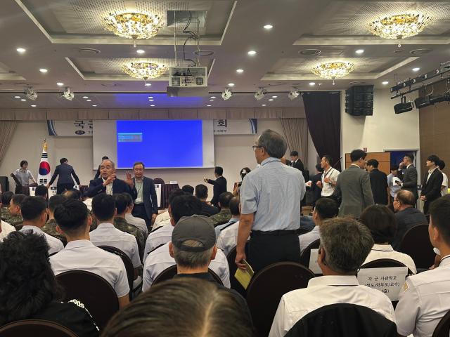 Attendees exchange heated words during a public hearing on the government’s military academy integration plan at the Defense Convention in Seoul on Aug 26 2026 AJP Kim Hee-su