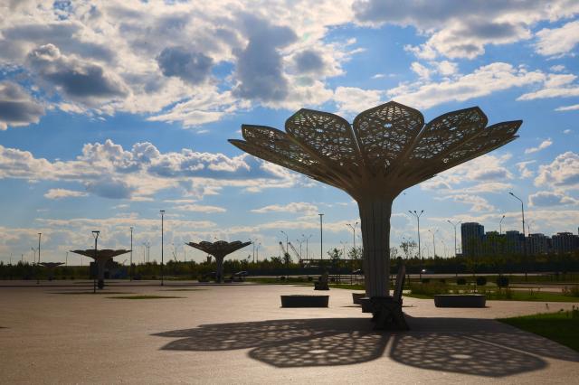 Tree-shaped shade structures cast long shadows across the grounds of the Grand Mosque in Astana Kazakhstan AJP Han Jun-gu