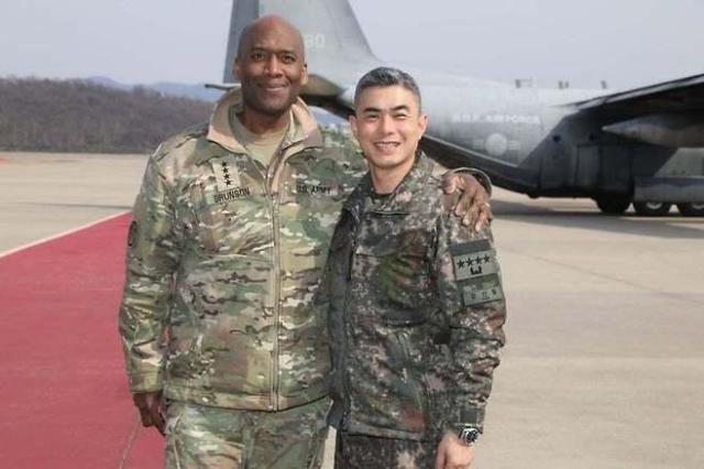 Gen Xavier Brunson left commander of the South Korea-US Combined Forces Command poses for a photo with Gen Kang Shin-chul then deputy commander of the CFC and now South Korea’s defense minister nominee at Seoul Air Base in Seongnam south of Seoul on March 17 2025 Captured from X