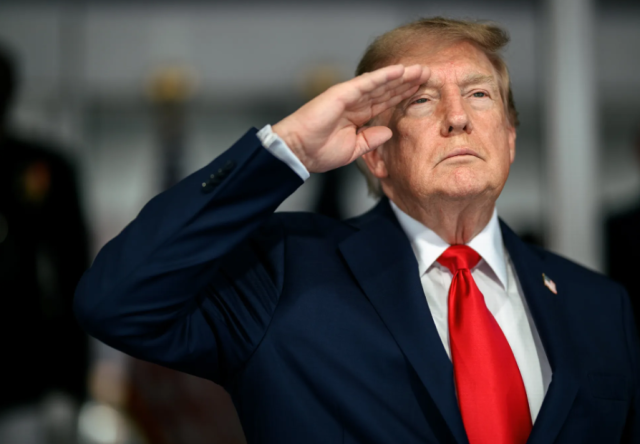 US President Donald Trump salutes during the national anthem before the start of the Freedom 250 Grand Prix in Washington DC on Aug 23 2026 The race was held as part of events marking the 250th anniversary of the United States Courtesy of the White House