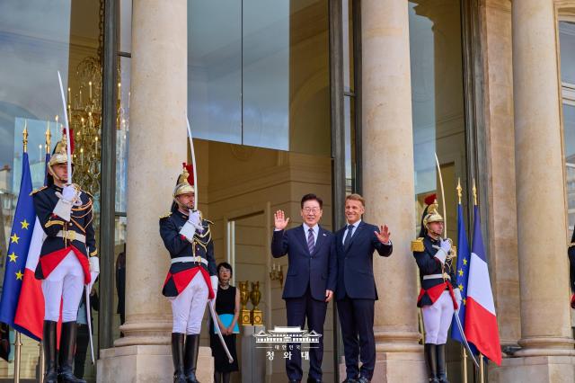 South Korean President Lee Jae Myung left and French President Emmanuel Macron pose for a photo at the Élysée Palace in Paris France on Sept 8 2026 Courtesy of Cheong Wa Dae