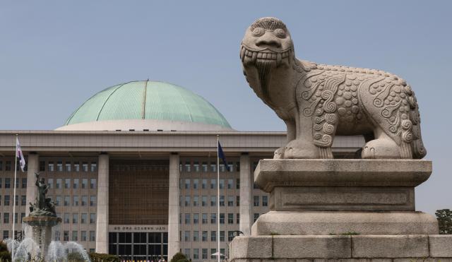 A stone haetae or haechi statue stands in front of the National Assembly building in Yeouido Seoul The mythical creature traditionally believed to distinguish right from wrong and ward off evil and disasters has long symbolized justice and integrity in Korean public life AJP Yoo Na-hyun 