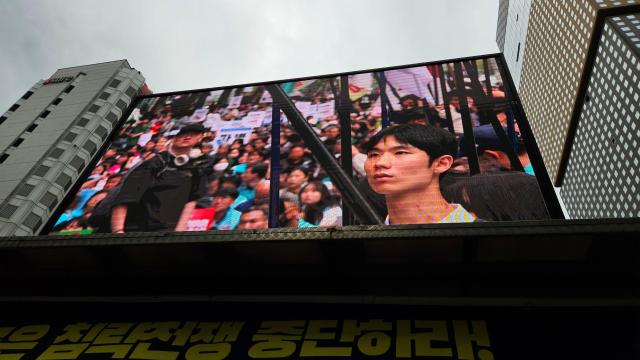The face of a young protester appears on a giant screen during a rally opposing South Korea’s possible deployment to the Strait of Hormuz in Jongno Seoul Sept 12 2026 AJP Lee Jung-woo 