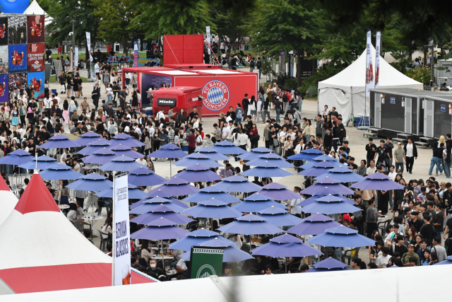 Crowds fill the outdoor Beer Garden and surrounding festival grounds in order to buy drinks and beer during Oktoberfest Seoul 2026 at Oil Tank Culture Park in western Seoul on Sept 12 2026 AJP Joonha Yoo