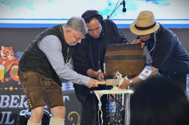 Jörn Beißert deputy head of mission at the German Embassy in Seoul taps a wooden beer keg during the opening ceremony of Oktoberfest Seoul 2026 at Oil Tank Culture Park in western Seoul on Sept 12 2026 AJP Joonha Yoo