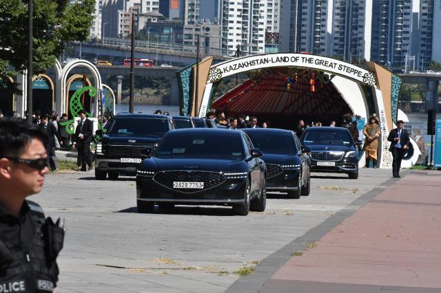 A motorcade leaves the Korea-Kazakhstan Cultural Heritage Exchange at Yeouido Hangang Park in Seoul on Sept 16 2026 with a Kazakhstan pavilion in the background AJP Joonha Yoo