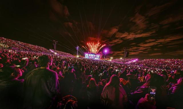 Fans fill the venue as fireworks light up the sky during STRAY KIDS STRAYCITY concert Courtesy of JYP Entertainment 