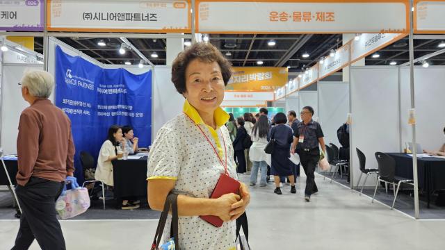 Jeon Sun-ok 74 poses for a photo during the Seoul Senior Job Fair 2026 at the aT Center in Seocho-gu Seoul Sept 17 2026 Jeon who previously ran a small business said the fair helped her learn more about job opportunities as a caregiver AJP Lee Jung-woo