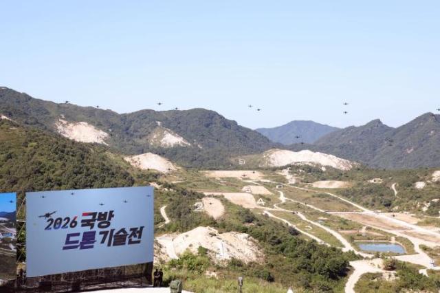 Swarm drones fly in search of targets during the 2026 Defense Drone Technology Exhibition at the Seungjin Training Ground in Pocheon Gyeonggi Province on Sept 16 2026 Courtesy of the state-run Kookbang Ilbo
