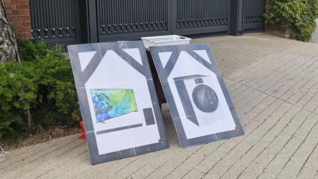 Signs depicting Samsung Electronics products and designed to resemble Korean funeral portraits are placed by the Donghaeng Union outside Chairman Lee Jae-yongs residence in Seoul on Sept 18 AJP Candice Kim