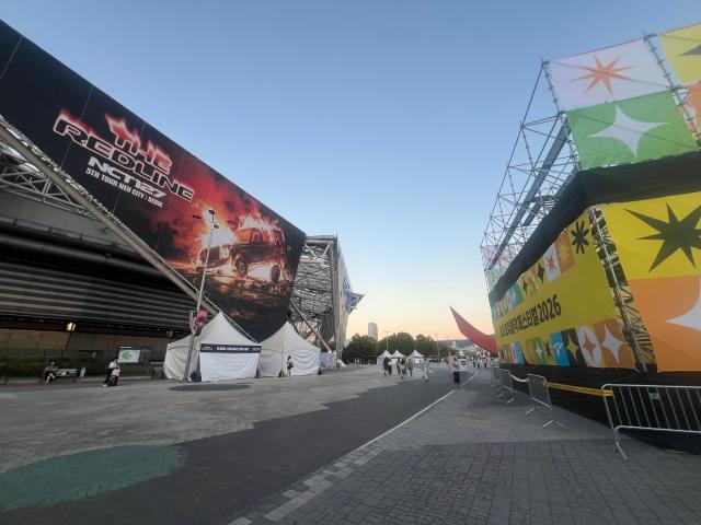 Banners for NCT 127s THE REDLINE tour and the KB Joy Olpark Festival 2026 hang outside KSPO Dome in Seouls Olympic Park at dusk AJP Joonha Yoo
