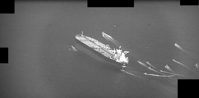 Iranian Revolutionary Guard Corps Navy fast-attack craft approach the Panama-flagged oil tanker Niovi as it transits the Strait of Hormuz on May 3 2023 Courtesy of the US Navy