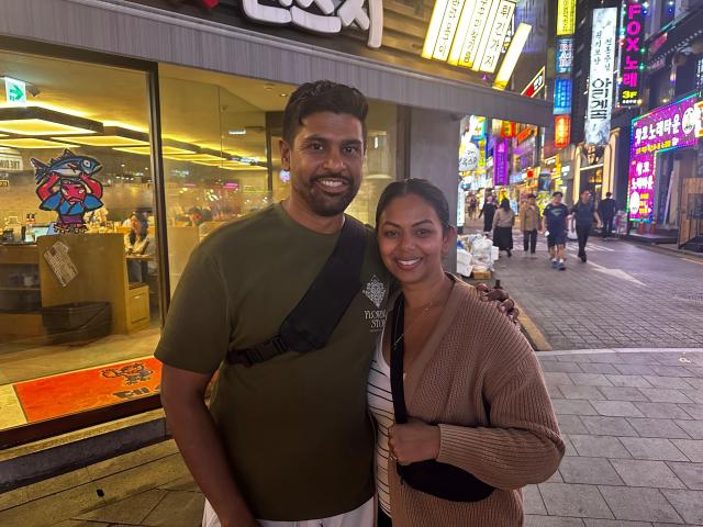 Terrence and Shivani visiting South Korea from Florida pose for a photo during a street interview in central Seoul on Sept 22 2026 AJP Kim Hee-su
