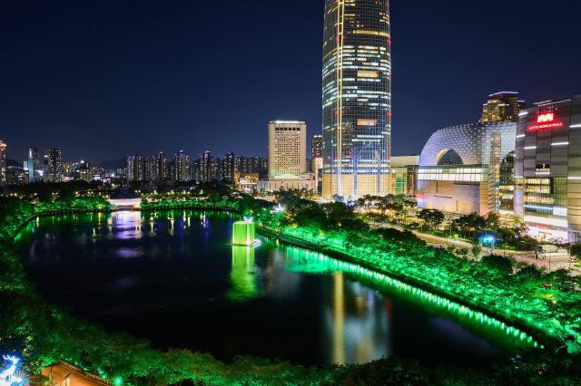 Seokchon Lake in Seoul is illuminated in green as part of an installation celebrating NCTs 10th anniversary Courtesy of SM Entertainment