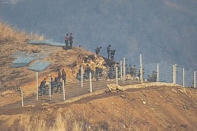 North Korean troops conduct excavation and quarrying work along the eastern section of the inter-Korean border in this image released by South Korea’s Joint Chiefs of Staff on March 27 2025