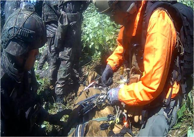 South Korean military personnel prepare to hoist an injured service member following a suspected mine explosion in the Demilitarized Zone in this image released by the Joint Chiefs of Staff during a briefing at the Defense Ministry in Seoul on Sept 28 2026 