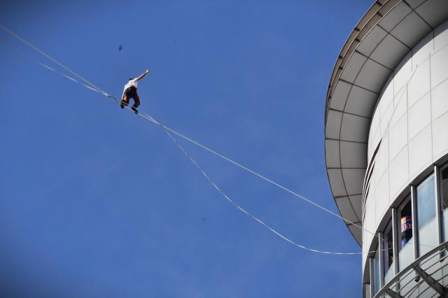 Estonian slackliner Jaan Roose walks on a 160 meter line stretched between two buildings near Gwanghwamun in central Seoul on Oct 1 2026 AJP Joonha Yoo