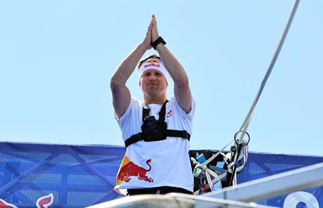 Estonian Red Bull slackliner Jaan Roose waves to spectators about 120 meters above the Gwanghwamun intersection in central Seoul on Oct 1 2026 ahead of his Red Bull Seoul Jultagi performance AJP Han Jun-gu