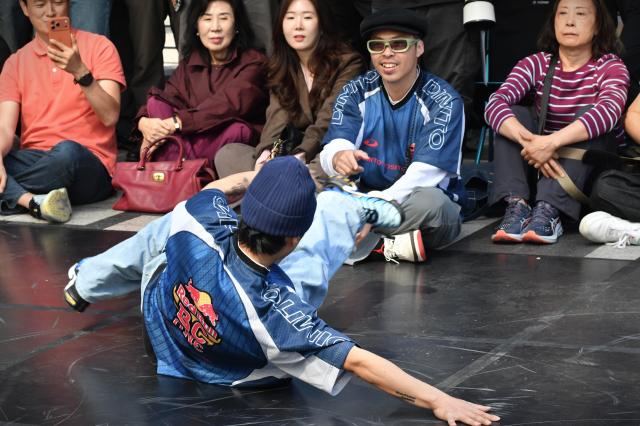 A breaker performs in front of spectators during a Red Bull event at Cheonggye Plaza in central Seoul on Oct 1 2026 AJP Joonha Yoo
