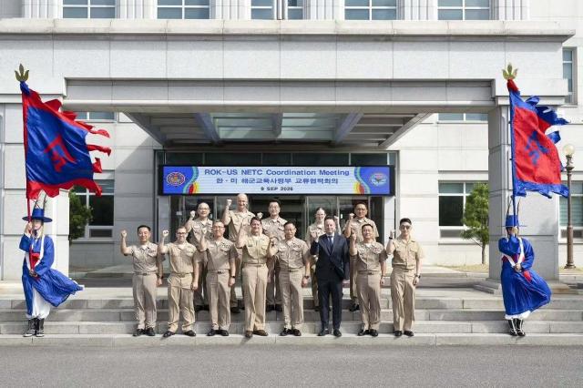 South Korean and US Navy officials pose for a group photo after a coordination meeting between their naval education and training commands in Jinhae Changwon on Sept 9 2026 Courtesy of ROK Navy Education and Training Command