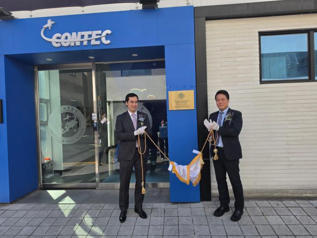 Kazakh Ambassador Asset Issenali left and Lee Sung-hee chairman of CONTEC Space Group and Kazakhstans newly installed honorary consul in Daejeon pose for a photo after unveiling the plaque of the Honorary Consulate of the Republic of Kazakhstan at CONTEC in Daejeon Oct 2 2026 AJP Park Sae-jin