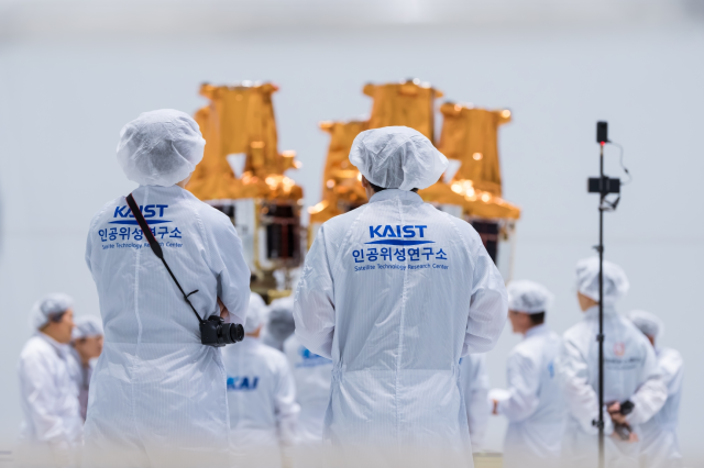Researchers carry out final checks on the five NEONSAT satellites mounted on the fifth Nuri rocket Courtesy of the Korea Aerospace Research Institute