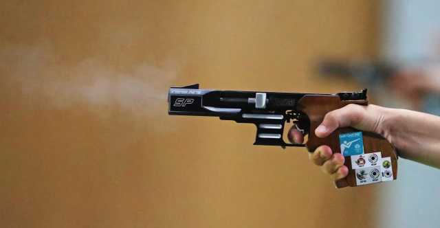 A competitor fires during the women’s 25-meter pistol final at the ISSF World Cup Final in Doha Qatar on Dec 7 2025 Screenshot from Olympicscom 
