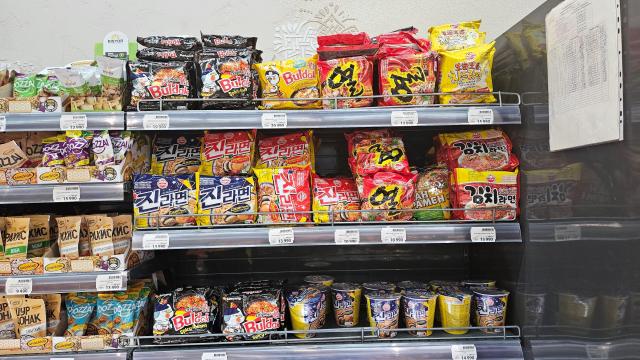 Packets of South Korean instant noodles featuring brand names written in Korean script are displayed on supermarket shelves in Tashkent Uzbekistan on Aug 24 2026 AJP Lee Jung-woo