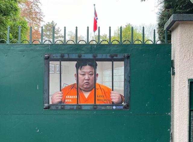 A poster depicting North Korean leader Kim Jong-un in prison attire behind bars is displayed at North Koreas diplomatic mission in Geneva Switzerland on Nov 6 2024 Courtesy of Jeski Social Campaign