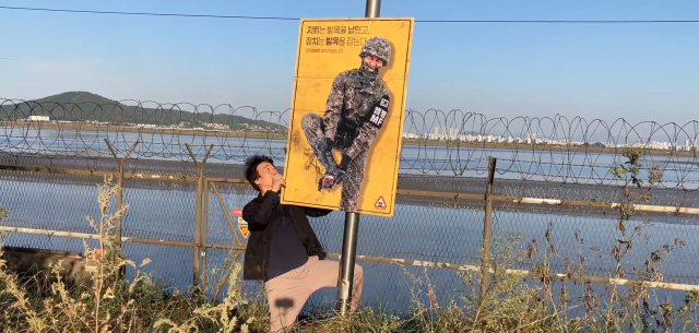 A one-legged billboard takes aim at South Koreas political divide