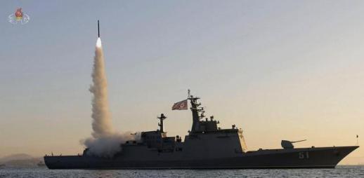 North Korea tests cruise missiles as US surveillance aircraft fly over peninsula