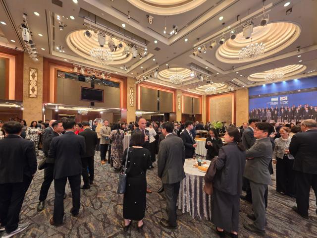 Guests talk at a reception marking the 35th anniversary of Uzbekistan’s independence at Lotte Hotel Seoul on Oct 21 2026 AJP Park Sae-jin