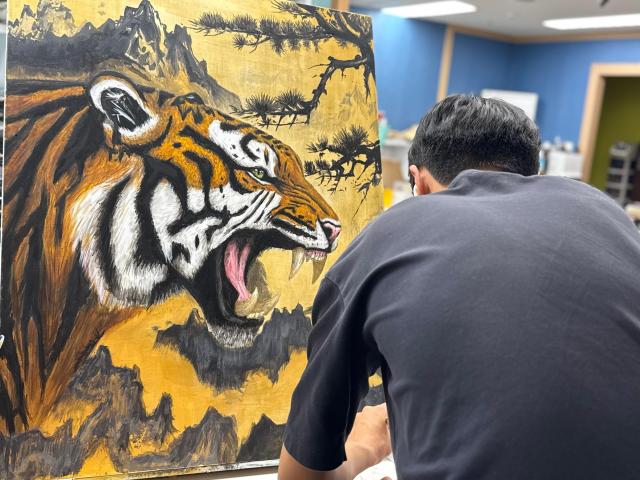 A student concentrates on a painting at Sally Mom Art a children’s art academy in Seongnam Gyeonggi Province whose students exhibited at “Memory for Tomorrow” in Seoul from Sept 30 to Oct 5 Courtesy of Sally Mom Art