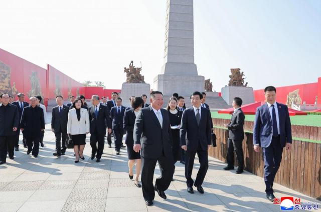 North Korean leader Kim Jong-un center arrives at a war memorial in Dandong during his visit to China on Oct 24 2026  in this photo released by the state-run North Korean Central News Agency the following day