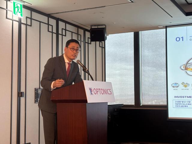 Optonics CEO Lee Young-woo speaks at the company’s IPO press conference at the 63 Building in Yeouido Seoul on Oct 26 2026 AJP Ryu Yuna