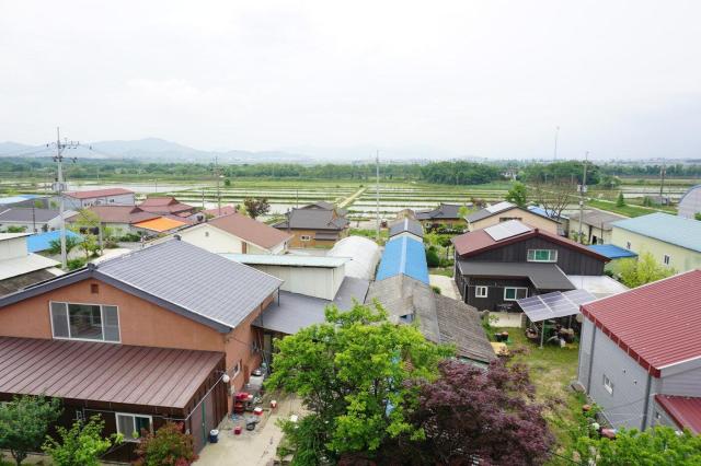 An aerial view of Daeseong-dong a civilian village inside the Demilitarized Zone DMZ in Paju Gyeonggi Province photographed from the village community center Courtesy of the National Research Institute of Cultural Heritage