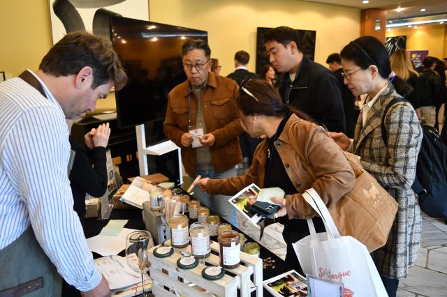 Visitors examine French food products and speak with an exhibitor at Food Experience Korea in Seoul Oct 26 2026 Courtesy of Joonha Yoo