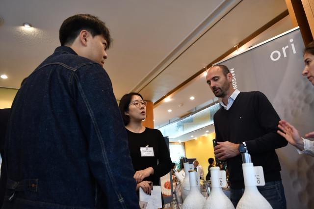 Visitors and exhibitors talk beside Maison Ori’s wine display at Food Experience Korea in Seoul Oct 26 2026 AJP Joonha Yoo