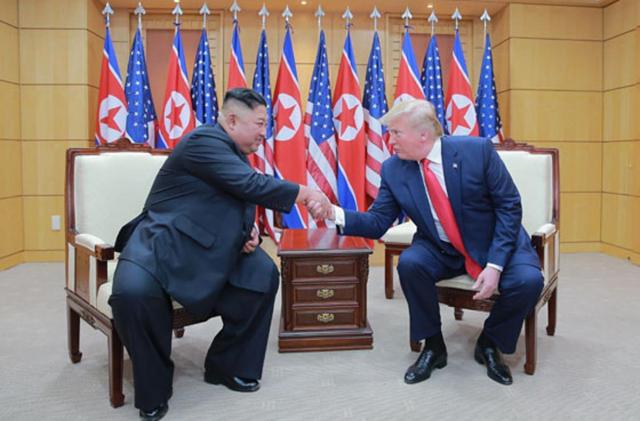 North Korean leader Kim Jong-un left meets US President Donald Trump on the South Korean side of Panmunjom in this photograph published by North Koreas Rodong Sinmun in July 2019 Courtesy of Rodong Sinmun 