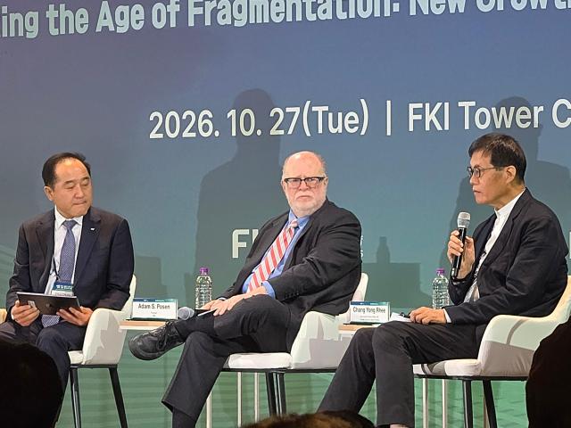 Former Bank of Korea Gov Rhee Chang-yong center speaks as Peterson Institute for International Economics President Adam Posen and Korea Economic Research Institute President Chung Chul listen during a panel discussion at the FKI-PIIE Joint International Conference in Seoul on Oct 27 2026 AJP Kim Yeon-jae
