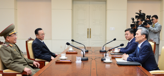 South and North Korean delegations sit across the table during high-level talks at the Peace House in Panmunjom on Aug 22 2015 Courtesy of the Ministry of Unifications Inter-Korean Dialogue Office