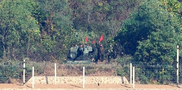 orth Korean soldiers stand beside what appears to be a 122-mm self-propelled artillery piece in Kaepung County across the border from Gimpo South Korea in a photo shared on the online community Diesel Mania on Oct 26 2026 Photo by Diesel Mania