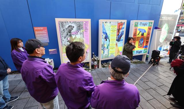 Bereaved family members of the 2022 Itaewon crowd crush listen to an explanation of newly unveiled memorial artwork during a ceremony at the Path of Memory and Safety in Itaewon Seoul on October 28 2026 a day before the fourth anniversary of the disaster AJP Yoo Na-hyun