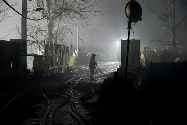 Fire fighters are extinguishing the last remaining fire throughout the Guryong Village Courtesy of CHOI Yohan