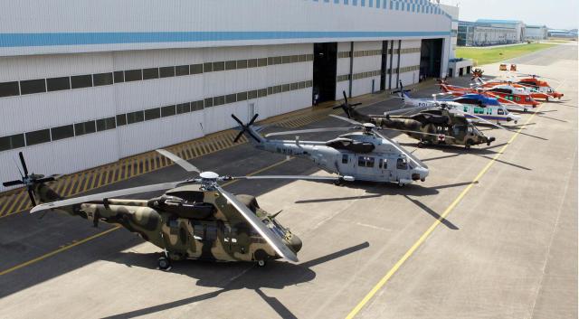 Various military and civilian variants of KAIs KUH-1 Surion helicopter are displayed outside the companys production facility in Sacheon South Korea Courtesy of KAI
