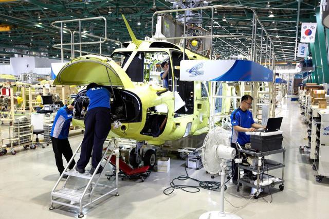 KAI technicians work on a KUH-1 Surion helicopter undergoing assembly at the companys manufacturing facility in Sacheon South Korea Courtesy of KAI