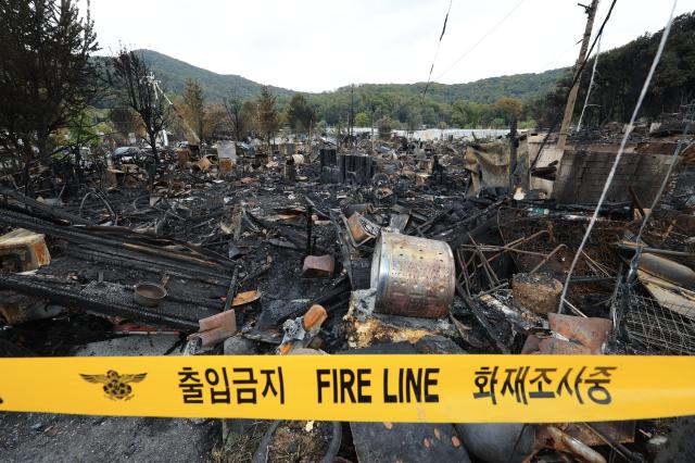 A day after the fire: Guryong Village in the aftermath