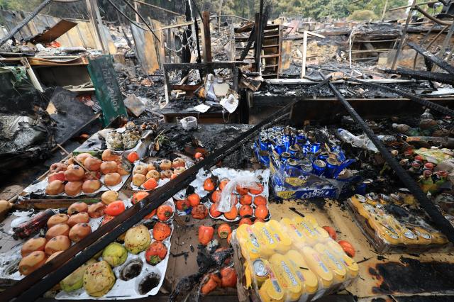A day after the fire: Guryong Village in the aftermath